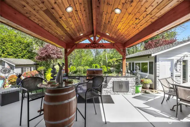AMAZING covered ENTERTAINING PATIO complete with:  Tongue & groove ceiling with recessed lighting  BBQ set up with granite counter, beverage frig, & storage cubbies  Prep bar with granite counter, drawers and storage