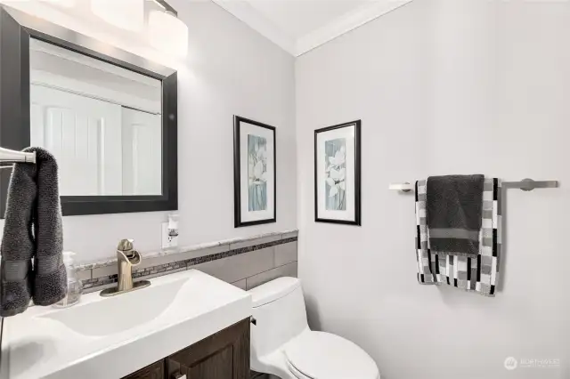 ½ Bath with tile floors. Closet with easy access to the furnace and water heater