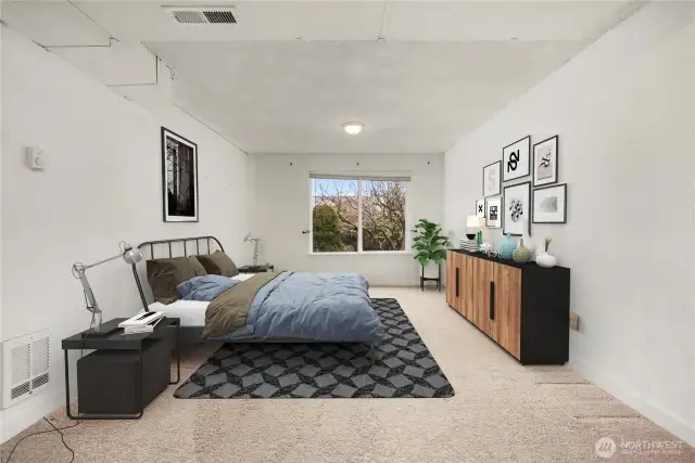 Virtually staged lower level bedroom.