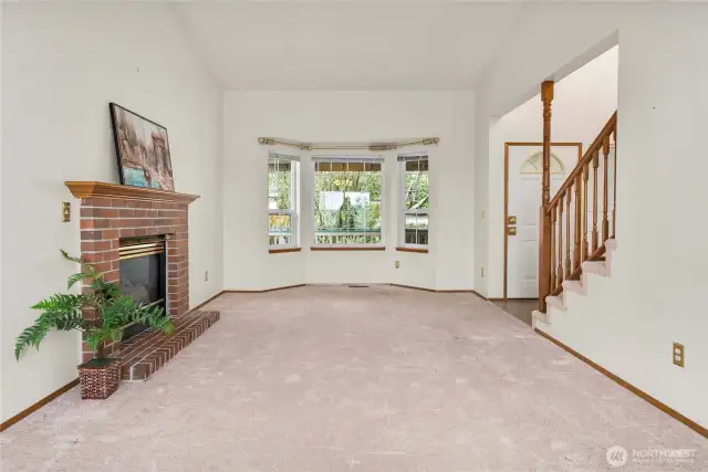 Looking back toward the entry and the bay window. Outside the window is a large covered deck.