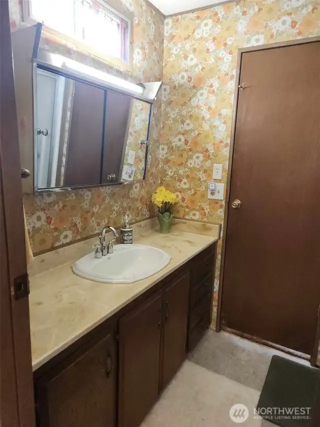 Off the entry way is the first 3/4 bath with a second door leading into the second bedroom.