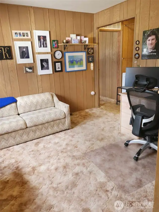 Angle of second bedroom from bathroom door.