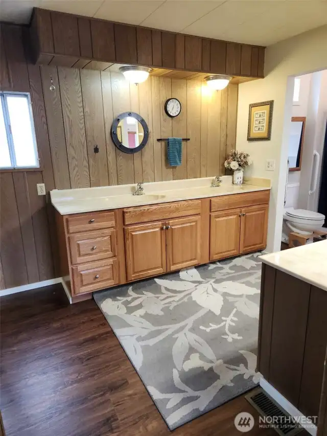 Very room and accessible main bathroom space with double sinks.