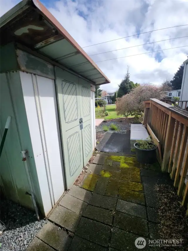 Behind the carport is a roomy shed for all your tools.