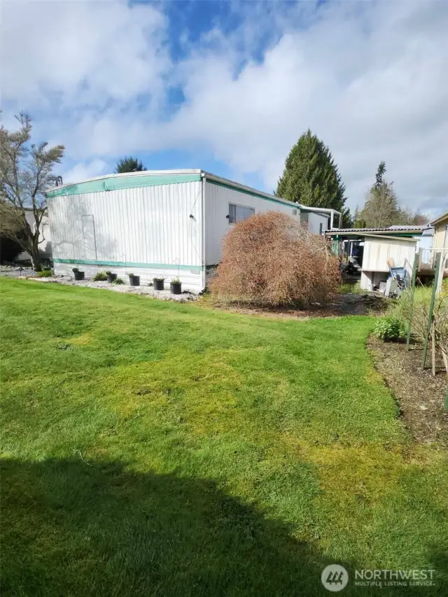 Here, you can see the back of the home and the storage shed.