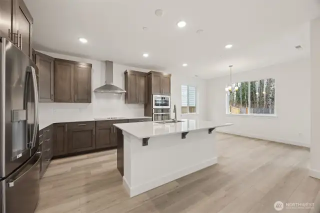 Gourmet kitchen overlooking island to dining