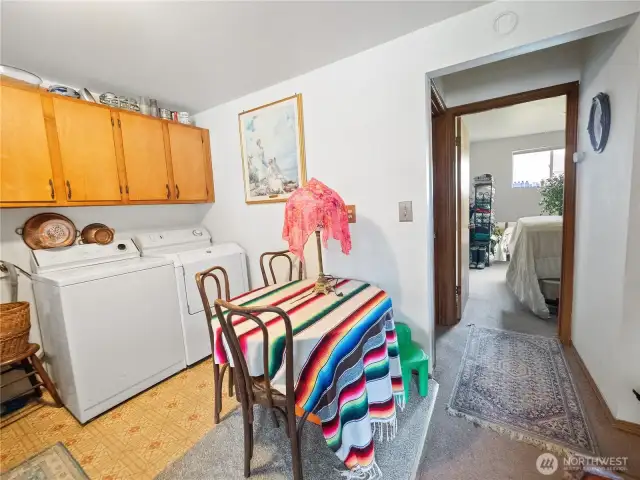 Washer/dryer/eating area toward bedrooms and bathroom in unit 2.