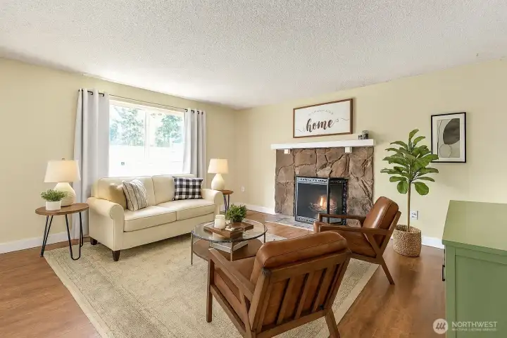 Virtual staged living room photo. Overlooks the front yard and driveway.
