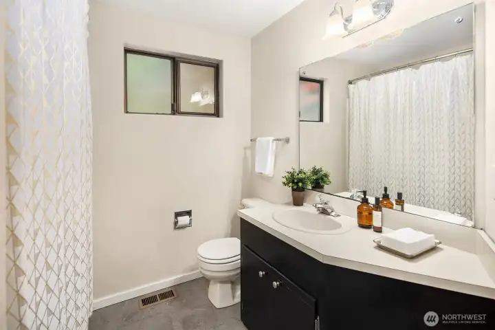 A full bath with Laundry right off the bonus room