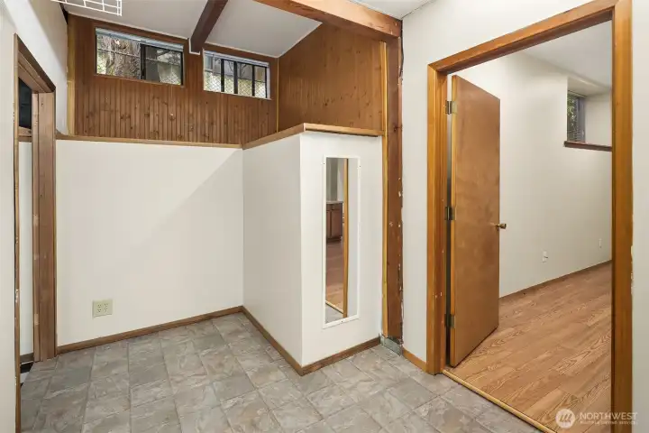 Pass through space from the game room to the ADU.  This could be the closet/storage area for the ADU easily.