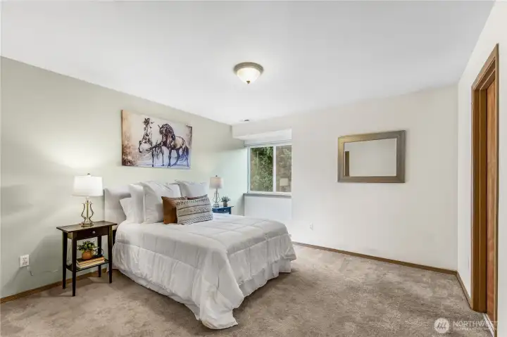 Primary bedroom that is very spacious and has walk in closet.