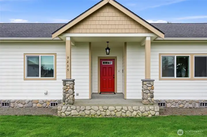 Thoughtfully designed, lovely front entry- love the River Rock accents!