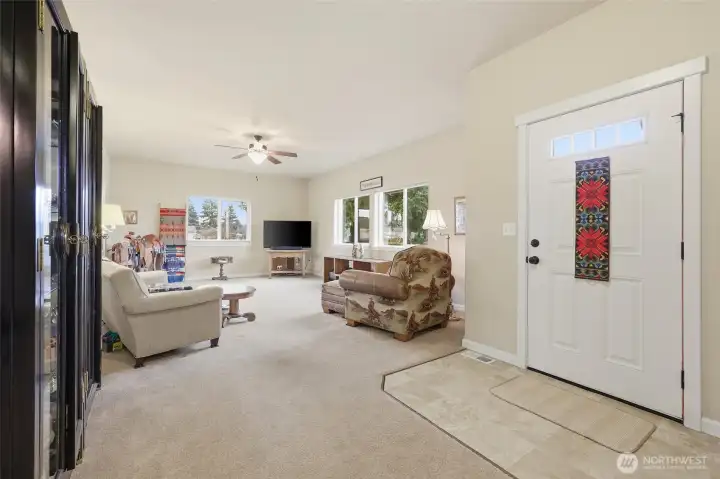 Inside the front entry- main living space connects to the kitchen on the left.
