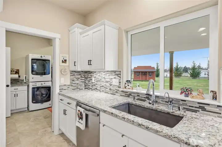 Instant hot water for your tea all day Utility room to the left- door to the outside.   Deep single sink- stainless steel matching dishwasher.  Everyone loves a window above the sink too!