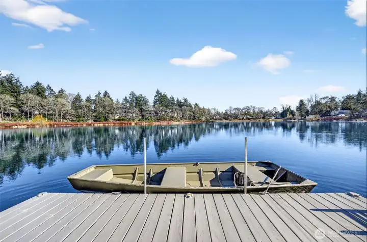 Private dock on glassy lakefront waters, perfect for unhurried mornings. Private dock on glassy lakefront waters, perfect for unhurried mornings.
