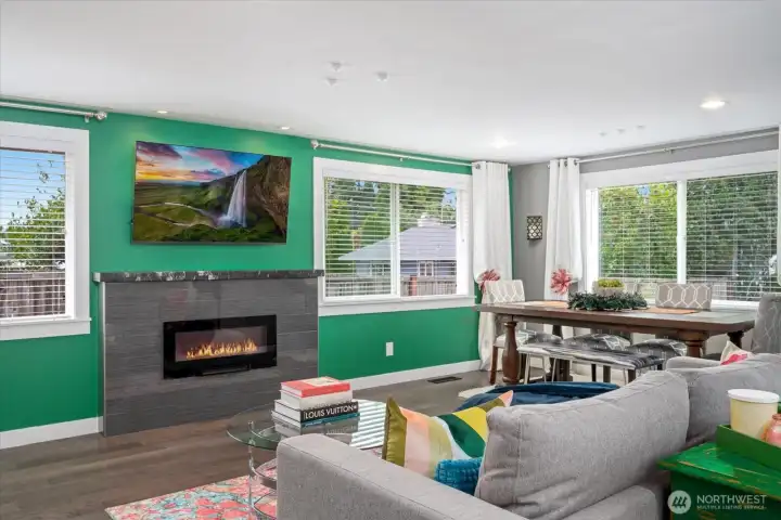 Large windows allow natural light to fill the space and a fireplace is perfectly placed to curl up on a winter night.