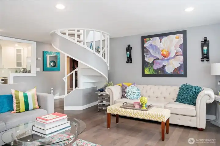 A charming spiral staircase goes to the upper level