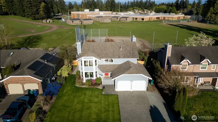 Overview showing middle school playfield directly behind the home