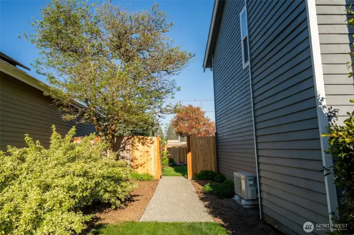 Side gate entrance between front and back yards