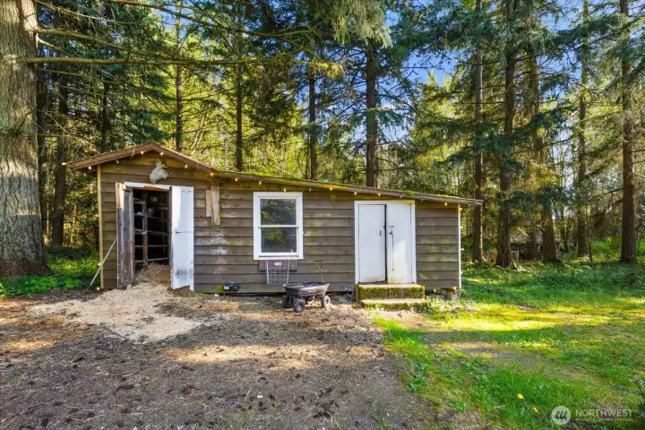 Outbuilding with power. Can be used for animals, tools, or both!