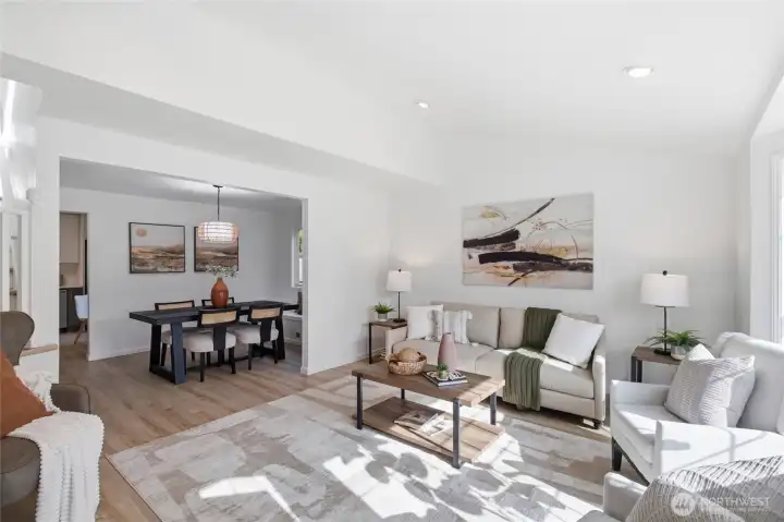 The living and dining areas connect effortlessly through an open archway, creating a bright, functional layout with great flow for everyday living and hosting.