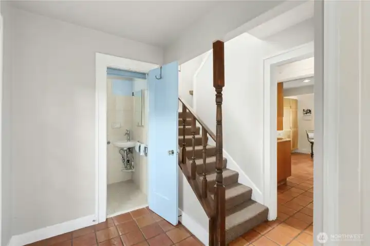 European style "Mud Room" 3/4 bath in entryway.