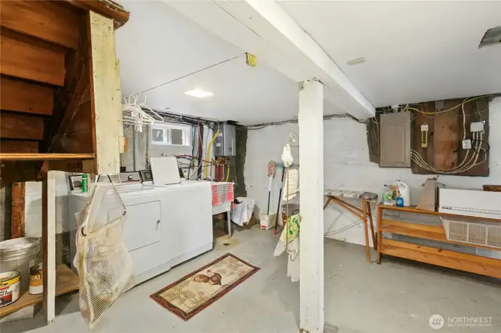 Large ruffed in basement with dark room set up.