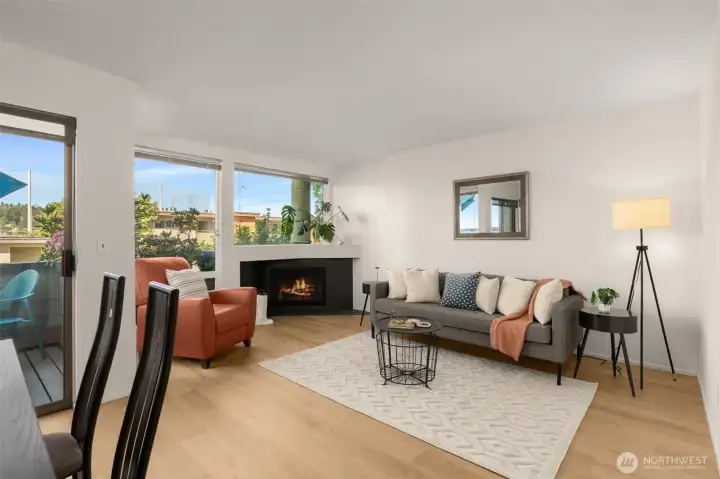 Living room with Wood burning corner fireplace Living room with Wood burning corner fireplace