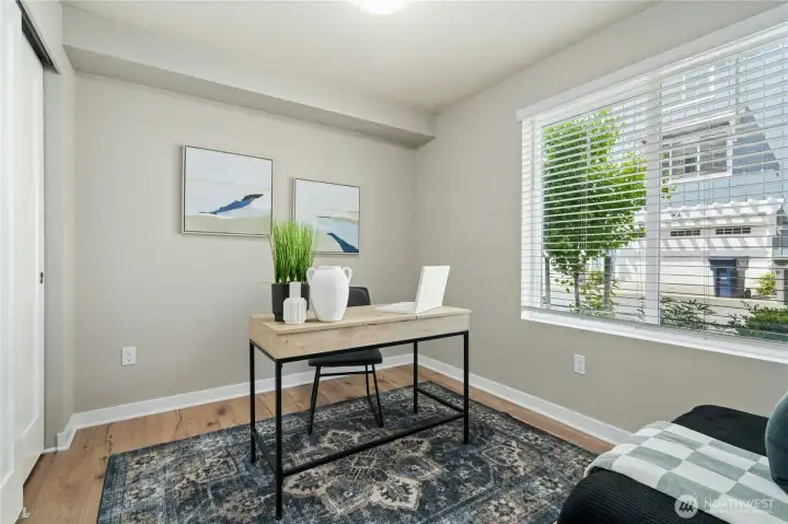 Versatile third bedroom perfect for guests, home office, or fitness space.