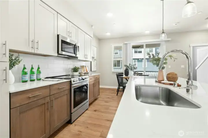 Shaker-style soft-close cabinetry and abundant storage make everyday living effortless.