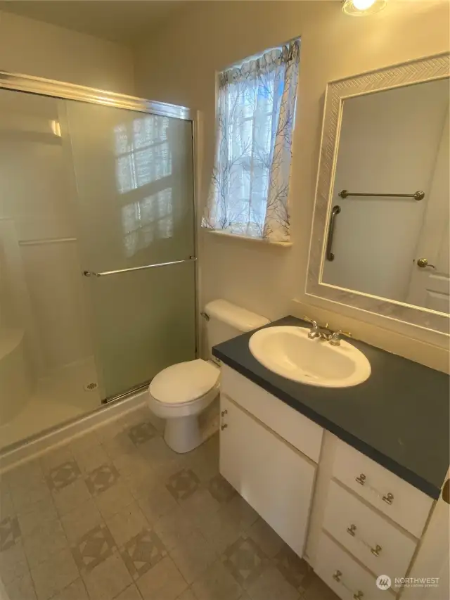 This pic does not do this bathroom justice so just come see it live. It does have a sturdy pull/grab bar on the left for safe shower assistance.