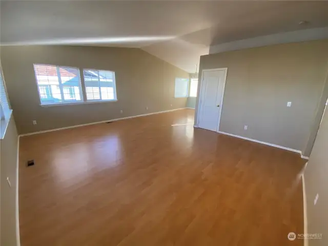 Fresh paint on some walls in this roomy living room & dining room.  I paced it off as 24’ wide left to right here and 19’ deep from front to the back of the dining room.   Vaulted ceiling are such a bonus!