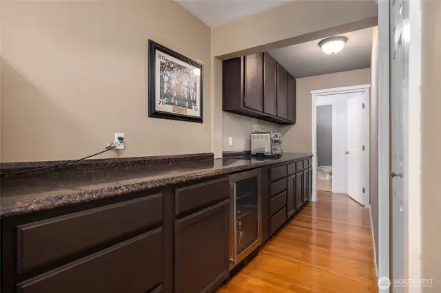 Wet Bar with so many storage cabinets.