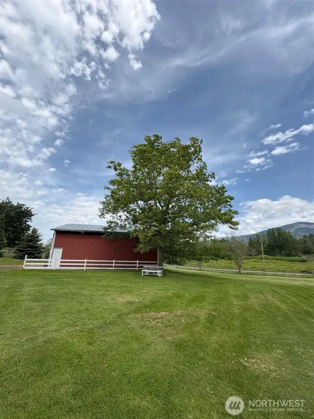 Absolutely Stunning!  Barn and fenced field for your own horses or lease it out for additional income.