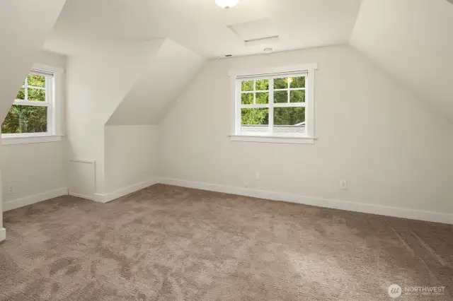 One of two upper level bedroooms, generous in size