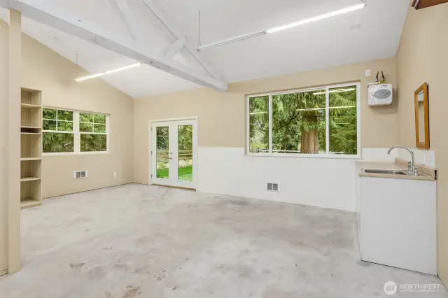 Large Hobby/Flex space off garage area with water, heater and outside access