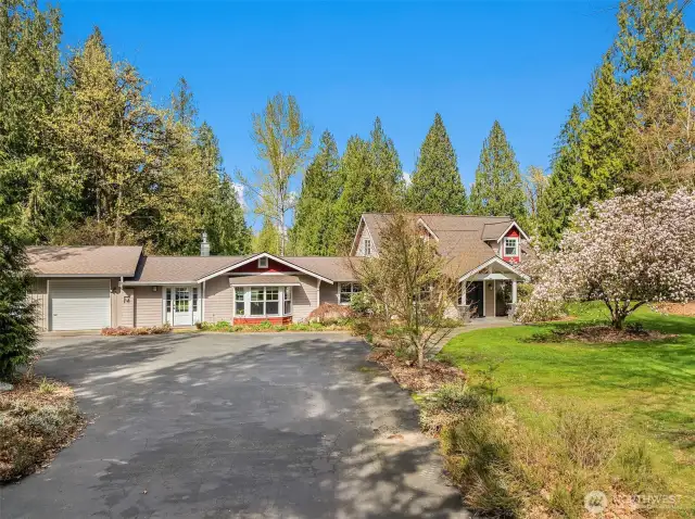 timeless style 1.5 story home with main floor primary.