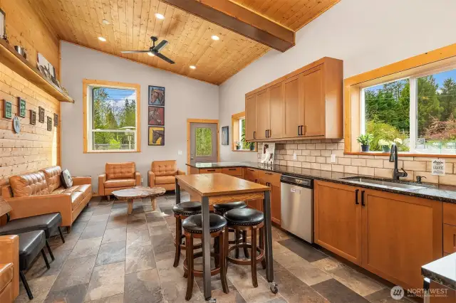 Luxury client lounge in Arena barn with kitchenette, T&G walls and ceilings and slate floors!