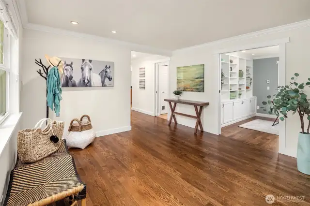 Inviting entry with newly refinished hardwoods throughout the main level of home