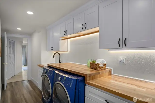 Spacious laundry rm has tons of storage