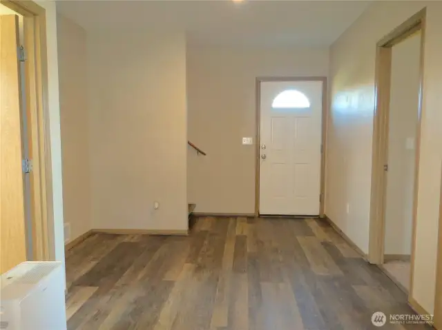 ANOTHER VIEW OF THE ENTERTAINMENT AREA TOWARD THE FRONT DOORWAY!