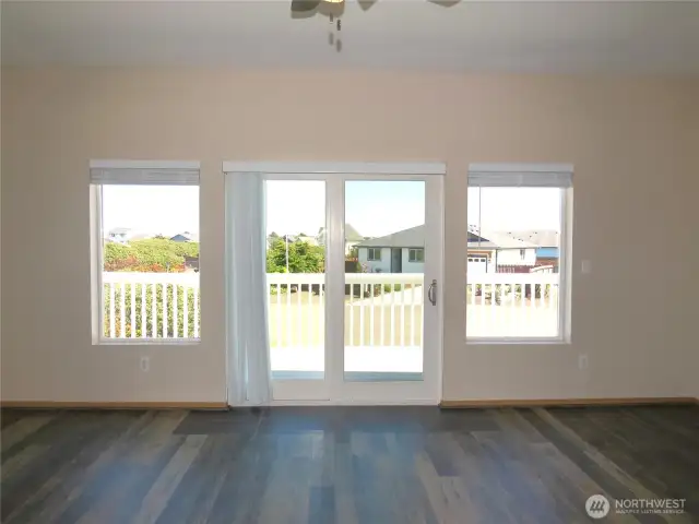 OPEN CONCEPT LIVING SPACE IS ON THE SECOND FLOOR WITH PLANK VINYL FLOORING~ENTERTAIN OR HAVE BARBEQUES ON THE ATTACHED DECK!