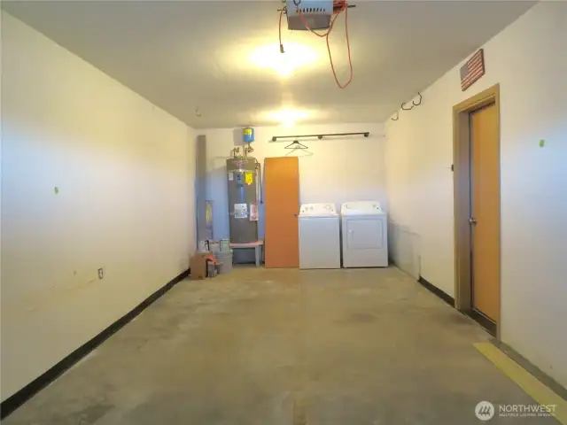 THE SINGLE CAR GARAGE DOUBLES AS A LAUNDRY ROOM AND OPENS INTO THE ENTERTAINMENT AREA!