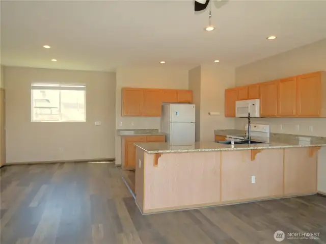 "U" SHASPED KITCHEN GIVES EASY ACCESS TO CABINETS AND NEWER APPLIANCES!