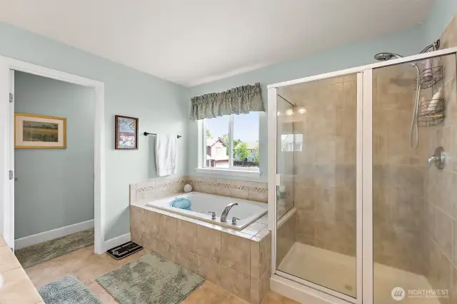 Primary has soaking tub and large shower