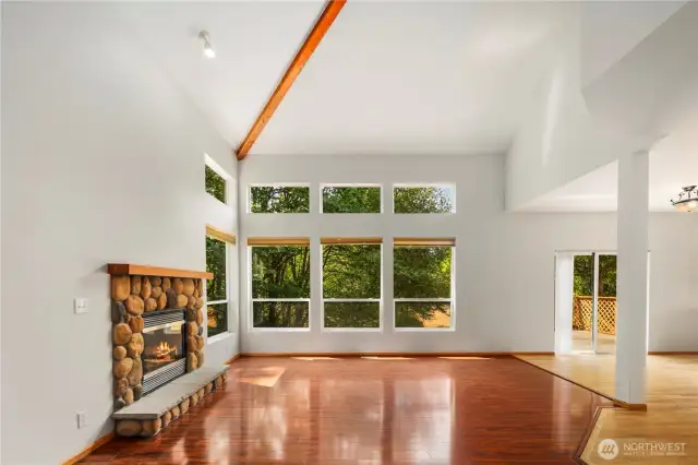 Living Room w/ Fireplace & High-Vaulted Ceilings