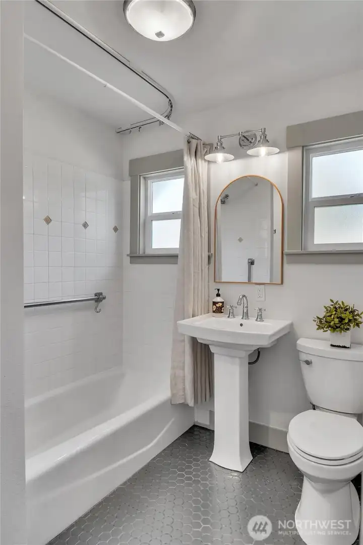 Full bath on the main, with adjacent laundry hook up.