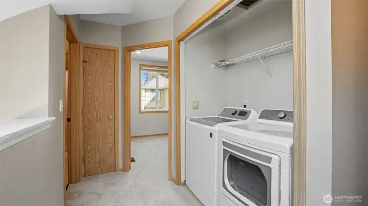 Laundry is conveniently located on the upper floor.
