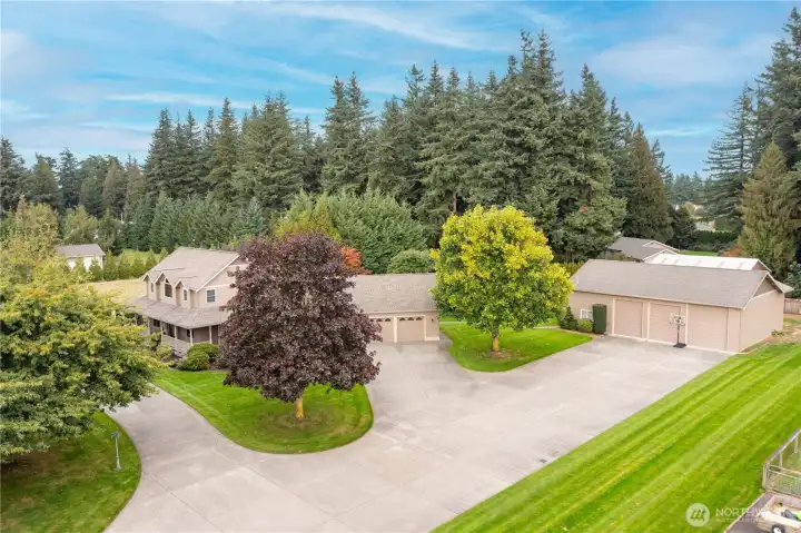 Well-appointed property with a total of 2.28 Acres, large 2 car garage, 36x65' shop with heated workshop & office, generous parking plus full RV hook-ups!