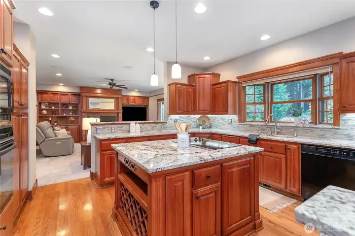 Kitchen is positioned between the family/great room and extra dining space